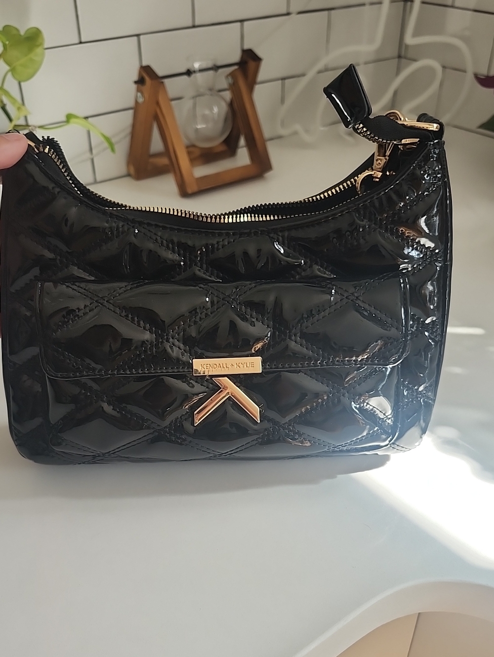Kendall & Kylie Shiny Black Quilted Patent Wristlet with Gold Hardware